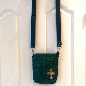 Small green shoulder bag.